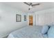 Inviting bedroom with a serene ambiance, featuring a mirror and closet for added convenience at 8931 W Alex Ave, Peoria, AZ 85382