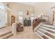 Spacious foyer with high ceilings, staircase, decorative furnishings, and views of the adjacent living spaces at 8931 W Alex Ave, Peoria, AZ 85382
