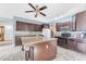 Updated kitchen featuring a large island, dark cabinets, granite countertops, and stainless appliances at 8931 W Alex Ave, Peoria, AZ 85382