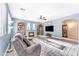 Spacious living room with a cozy fireplace, comfortable seating, and ample natural light at 8931 W Alex Ave, Peoria, AZ 85382