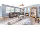 Cozy living room showcasing a fireplace, stylish furnishings, neutral colors, and ample natural light at 8931 W Alex Ave, Peoria, AZ 85382