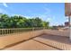 Spacious outdoor patio area with views of lush trees and a blue sky, ideal for enjoying nature at 8931 W Alex Ave, Peoria, AZ 85382