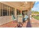 Relax on this covered patio with wood-look tile and a ceiling fan, perfect for enjoying the outdoors at 8931 W Alex Ave, Peoria, AZ 85382