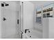 Modern bathroom with a glass-enclosed shower and a tub under a window at 896 N Kingston St, Gilbert, AZ 85233