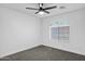 Bedroom with a ceiling fan, window and carpet flooring at 896 N Kingston St, Gilbert, AZ 85233