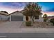 Lovely single-story home with a two-car garage, desert landscaping, and a well-lit entrance at 896 N Kingston St, Gilbert, AZ 85233
