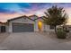 Charming single-story home featuring a two-car garage, well-manicured landscaping, and a walkway to the front door at 896 N Kingston St, Gilbert, AZ 85233