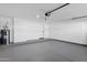 View of the spacious garage with epoxy flooring and a water heater at 896 N Kingston St, Gilbert, AZ 85233