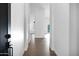 Bright hallway featuring hardwood floors, fresh paint, and natural light at 896 N Kingston St, Gilbert, AZ 85233