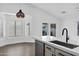 Bright kitchen with pendant lighting, modern sink fixtures, and quartz countertops at 896 N Kingston St, Gilbert, AZ 85233