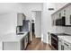 Bright kitchen featuring gray cabinets, quartz countertops, and stainless appliances at 896 N Kingston St, Gilbert, AZ 85233