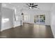 Bright living room with tile floors, ceiling fan, and sliding glass doors at 896 N Kingston St, Gilbert, AZ 85233