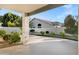 Covered patio offering a shaded retreat with views of the landscaped backyard at 896 N Kingston St, Gilbert, AZ 85233