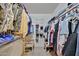 Well-organized closet with ample storage space for clothes and shoes at 10648 W Loma Blanca Dr, Sun City, AZ 85351