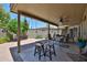 Spacious covered patio with a ceiling fan, outdoor furniture, and views of the backyard at 10648 W Loma Blanca Dr, Sun City, AZ 85351