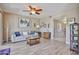 Bright living room featuring modern decor, and a comfortable seating area at 10648 W Loma Blanca Dr, Sun City, AZ 85351