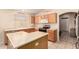 Bright kitchen boasting wooden cabinets, modern appliances, and ample countertop space at 13022 W Cherry Hills Dr, El Mirage, AZ 85335
