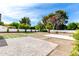 Expansive backyard featuring low maintenance landscaping, with artificial turf, gravel and pavers at 1304 W Ocotillo Rd, Phoenix, AZ 85013