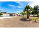 Expansive backyard featuring low maintenance landscaping, with artificial turf, gravel and pavers at 1304 W Ocotillo Rd, Phoenix, AZ 85013
