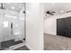 Modern bathroom with tiled shower, glass door, and an entry to a bedroom at 1304 W Ocotillo Rd, Phoenix, AZ 85013