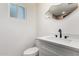This is a contemporary bathroom with a stylish mirror and modern fixtures with a white vanity at 1304 W Ocotillo Rd, Phoenix, AZ 85013