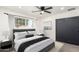 Cozy bedroom with soft lighting, a queen-sized bed, and a closet with sliding doors at 1304 W Ocotillo Rd, Phoenix, AZ 85013