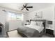Cozy bedroom featuring a queen-sized bed, neutral colors and carpet, and a ceiling fan at 1304 W Ocotillo Rd, Phoenix, AZ 85013