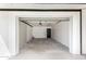Spacious two car garage with white walls, concrete floor, and interior door at 1304 W Ocotillo Rd, Phoenix, AZ 85013