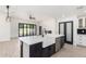 Bright open kitchen with a large island, stainless steel appliances, and backyard view at 1304 W Ocotillo Rd, Phoenix, AZ 85013