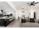 Open-concept living space with modern kitchen, dining area, and comfortable seating at 1304 W Ocotillo Rd, Phoenix, AZ 85013
