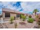 Well-maintained backyard with gravel landscaping, mature greenery, and a glimpse of the inviting pool at 15809 S 31St St, Phoenix, AZ 85048