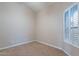 Cozy bedroom with neutral carpet, window with shutters, and electrical outlets at 15809 S 31St St, Phoenix, AZ 85048