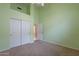 Spacious bedroom features neutral carpet, light green walls, and a closet with bi-fold doors at 15809 S 31St St, Phoenix, AZ 85048
