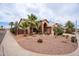 Lovely single-story home with desert landscaping featuring native plants, palm trees and a two-car garage at 15809 S 31St St, Phoenix, AZ 85048