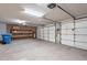 Spacious garage featuring storage shelves and a two car door at 15809 S 31St St, Phoenix, AZ 85048