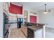 Open kitchen with granite counters, black appliances, and a breakfast bar at 15809 S 31St St, Phoenix, AZ 85048