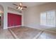 Bright living room featuring tile floors with decorative inlays and a modern ceiling fan at 15809 S 31St St, Phoenix, AZ 85048