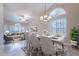Bright, open living room with vaulted ceilings, large windows, and combined dining area at 15809 S 31St St, Phoenix, AZ 85048
