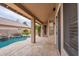 Covered patio with travertine flooring and a view of the pool at 15809 S 31St St, Phoenix, AZ 85048