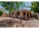 Spacious backyard with gravel landscaping, covered patio, and well-maintained exterior at 15941 N 171St Ln, Surprise, AZ 85388
