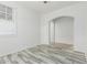 Bright bedroom with stylish, modern flooring and an arched doorway at 15941 N 171St Ln, Surprise, AZ 85388