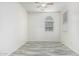 Inviting bedroom featuring a decorative window and stylish, modern flooring at 15941 N 171St Ln, Surprise, AZ 85388