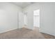 Neutral bedroom with carpet and open doorway to closet or ensuite bathroom at 15941 N 171St Ln, Surprise, AZ 85388