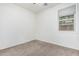 Neutral bedroom features carpet flooring and a single window at 15941 N 171St Ln, Surprise, AZ 85388