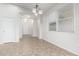 Bright dining room features tile flooring, a contemporary light fixture, and natural light streaming through the window at 15941 N 171St Ln, Surprise, AZ 85388