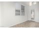Bright dining room features tile flooring and a glass door leading to the outside at 15941 N 171St Ln, Surprise, AZ 85388