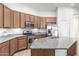 Well-lit kitchen featuring stainless steel appliances, granite countertops, and abundant cabinetry at 15941 N 171St Ln, Surprise, AZ 85388