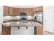 Modern kitchen with a large center island, stainless steel appliances, and plentiful cabinet space at 15941 N 171St Ln, Surprise, AZ 85388