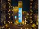 Night aerial view highlighting the community pool featuring a unique design and lounge area at 17 W Vernon Ave # 31, Phoenix, AZ 85003