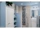 Bathroom with walk-in shower, shelving, and modern fixtures provides a clean aesthetic at 17 W Vernon Ave # 31, Phoenix, AZ 85003